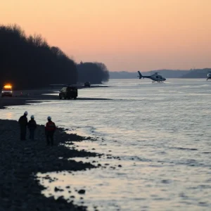 Emergency recovery teams working on the Potomac River after a plane and helicopter collision.