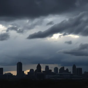 Dramatic Kansas City skyline under stormy clouds